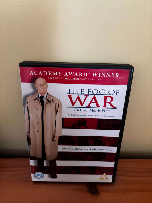 DVD case for 'The Fog of War' on a wooden surface