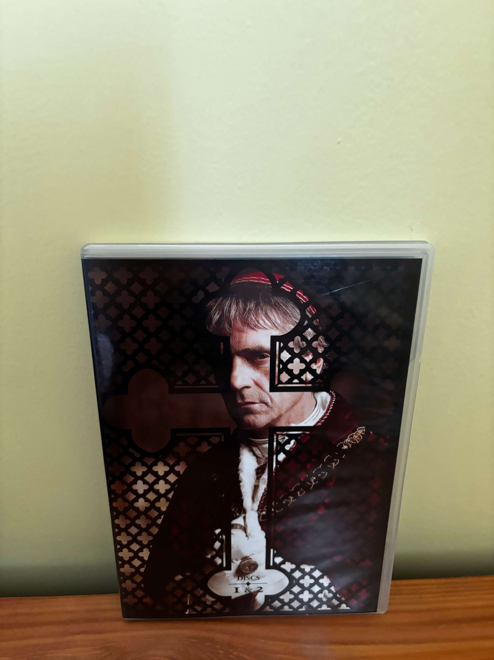 DVD case with a person's face on the cover against a checkered pattern