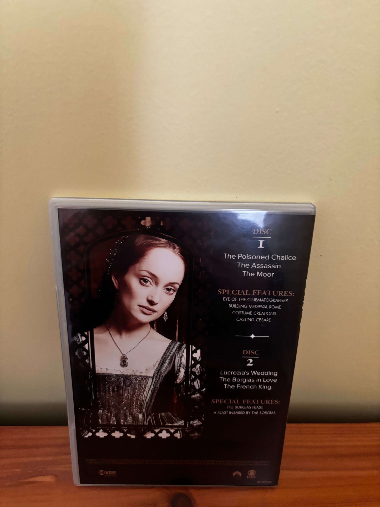 DVD case with a black and white image of a woman on a beige surface