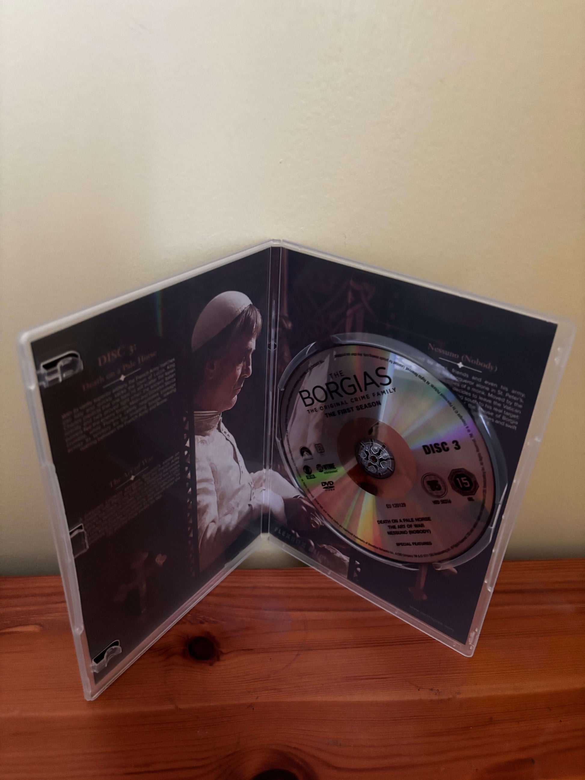 CD in a transparent case on a wooden surface