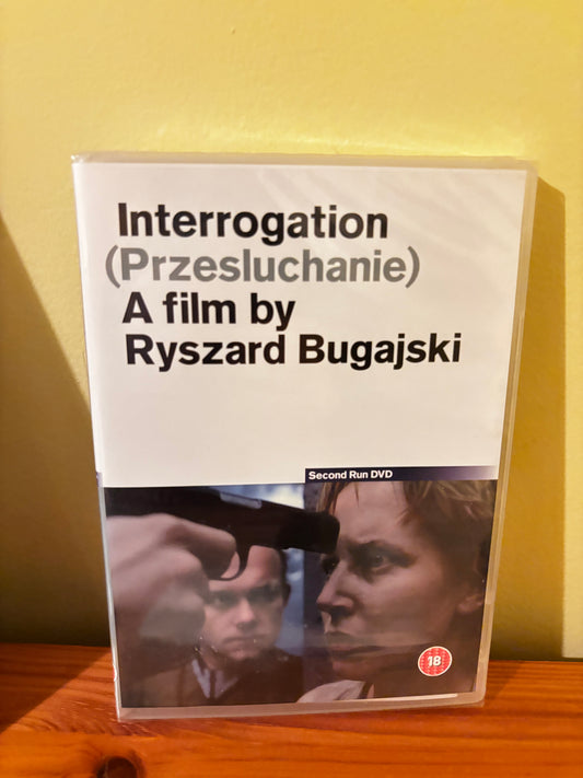 Interrogation (Przesluchanie) DVD cover by Ryszard Bugajski (1982, World Cinema); sealed edition, gun pointed at a man's face.