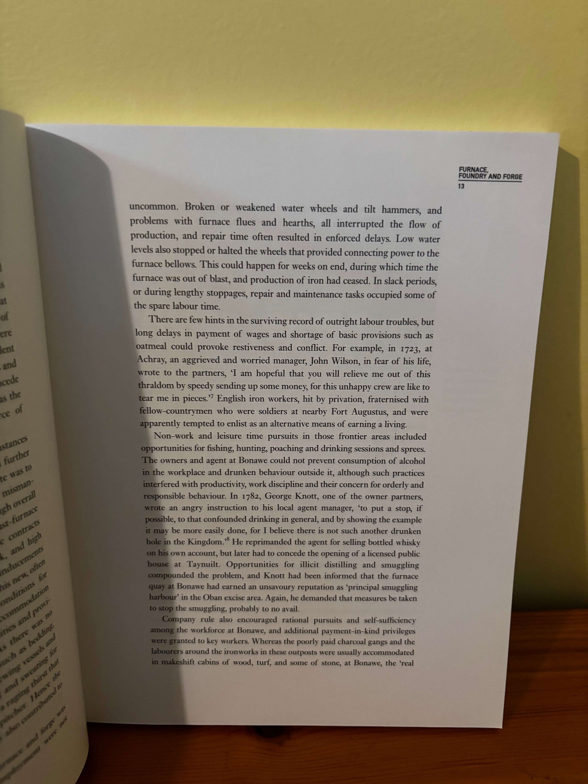 Open book with text on a plain background