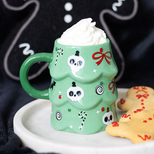 Add spooky cheer to your mornings with the Creepy Christmas Tree Mug, featuring skulls, candy canes, and festive bows.