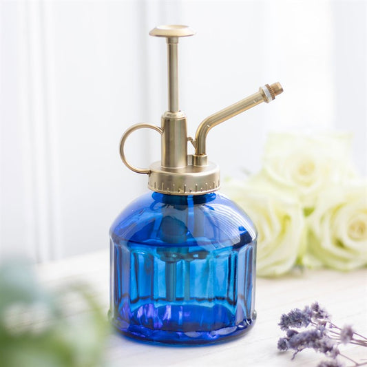 Small Blue Glass Plant Mister with vintage design and gold pump, ideal for indoor gardening enthusiasts.