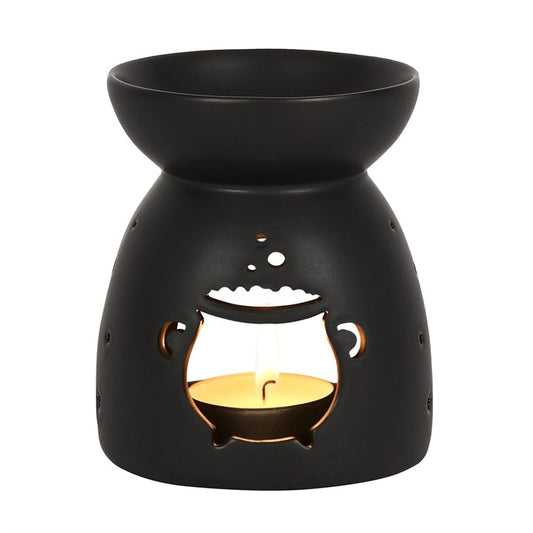 Black Cauldron Cut Out Oil Burner in matte black ceramic, for fragrance oil or wax, candle glow.
