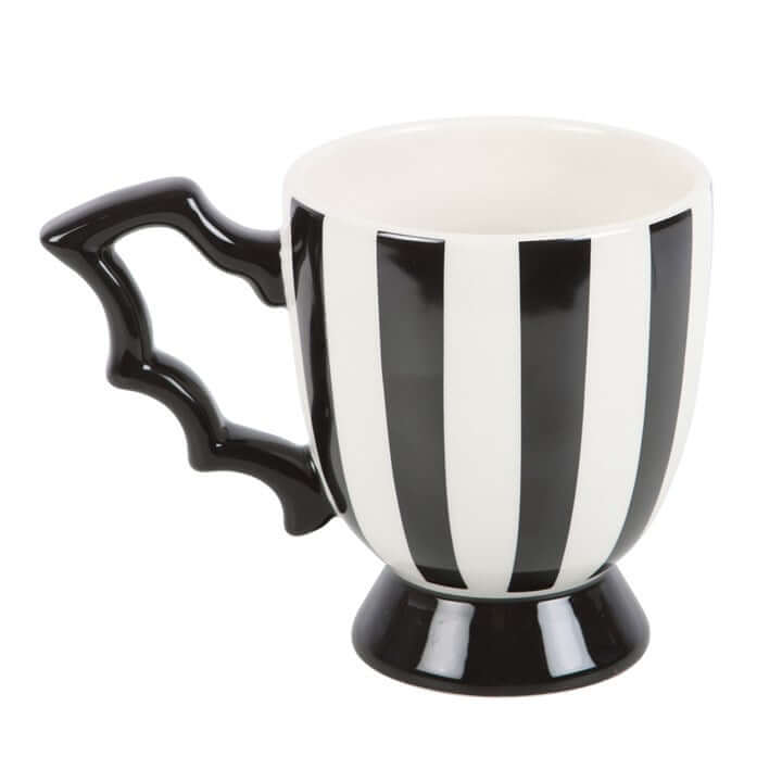 Striped bat wing teacup, a ceramic mug with black and white vertical stripes and bat-wing handle on a small pedestal.