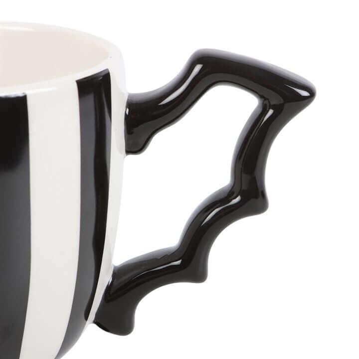 Striped ceramic teacup with black bat-wing handle, monochrome stripes, 490ml capacity.