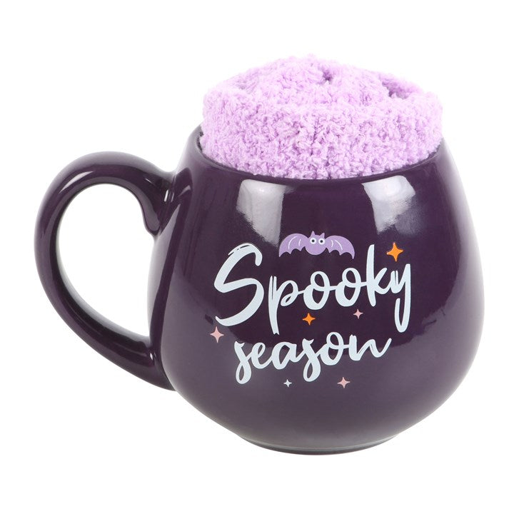 Delightful Spooky Season Mug and Socks Set featuring a purple mug and cosy lilac socks, perfect for Halloween.