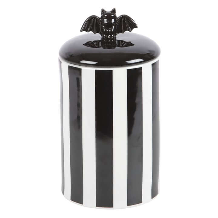 Striped Bat Storage Jar, ceramic with black and white vertical stripes and a bat-shaped lift-off lid.