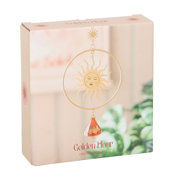Golden Hour Crystal Suncatcher with elegant sun design and vibrant orange crystal, perfect for brightening any space.