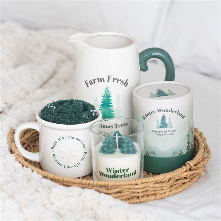 Winter Wonderland Candle with Tree Scene set: unscented ceramic jug, mugs and mini trees on a wicker tray.