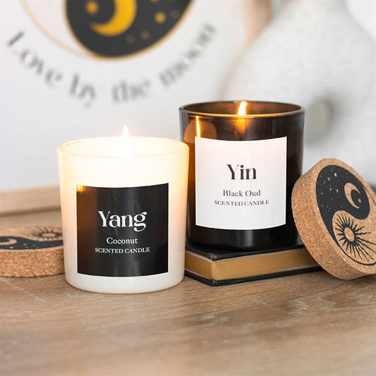 Set of 2 Yin Yang Black Oud and Coconut Candles, offering balanced scents for day and night in stylish containers.