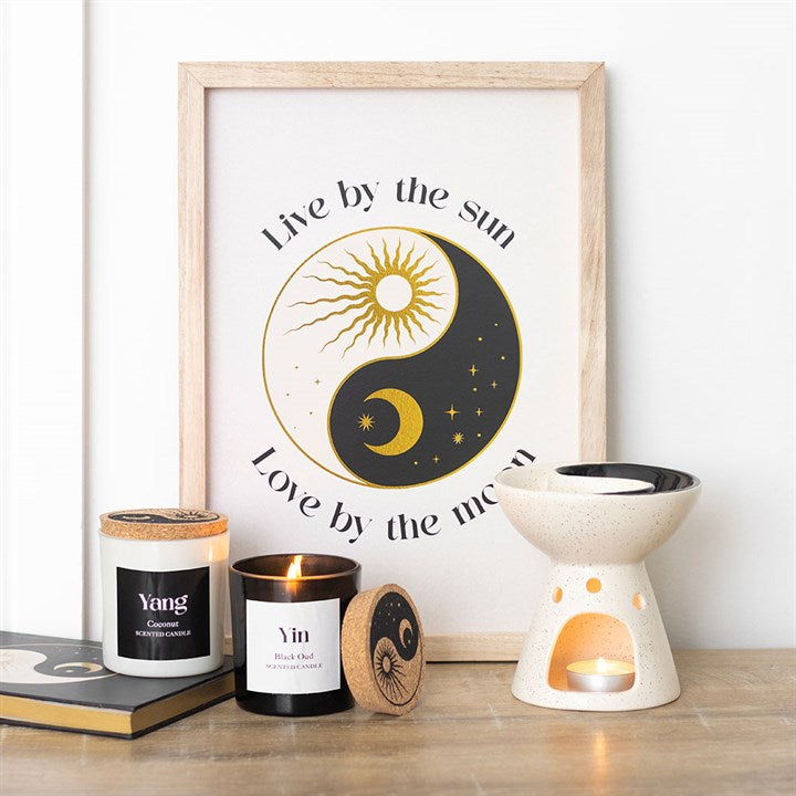 Set of 2 Yin Yang Black Oud and Coconut Candles displayed with a decorative frame and wax warmer, perfect for home balance.