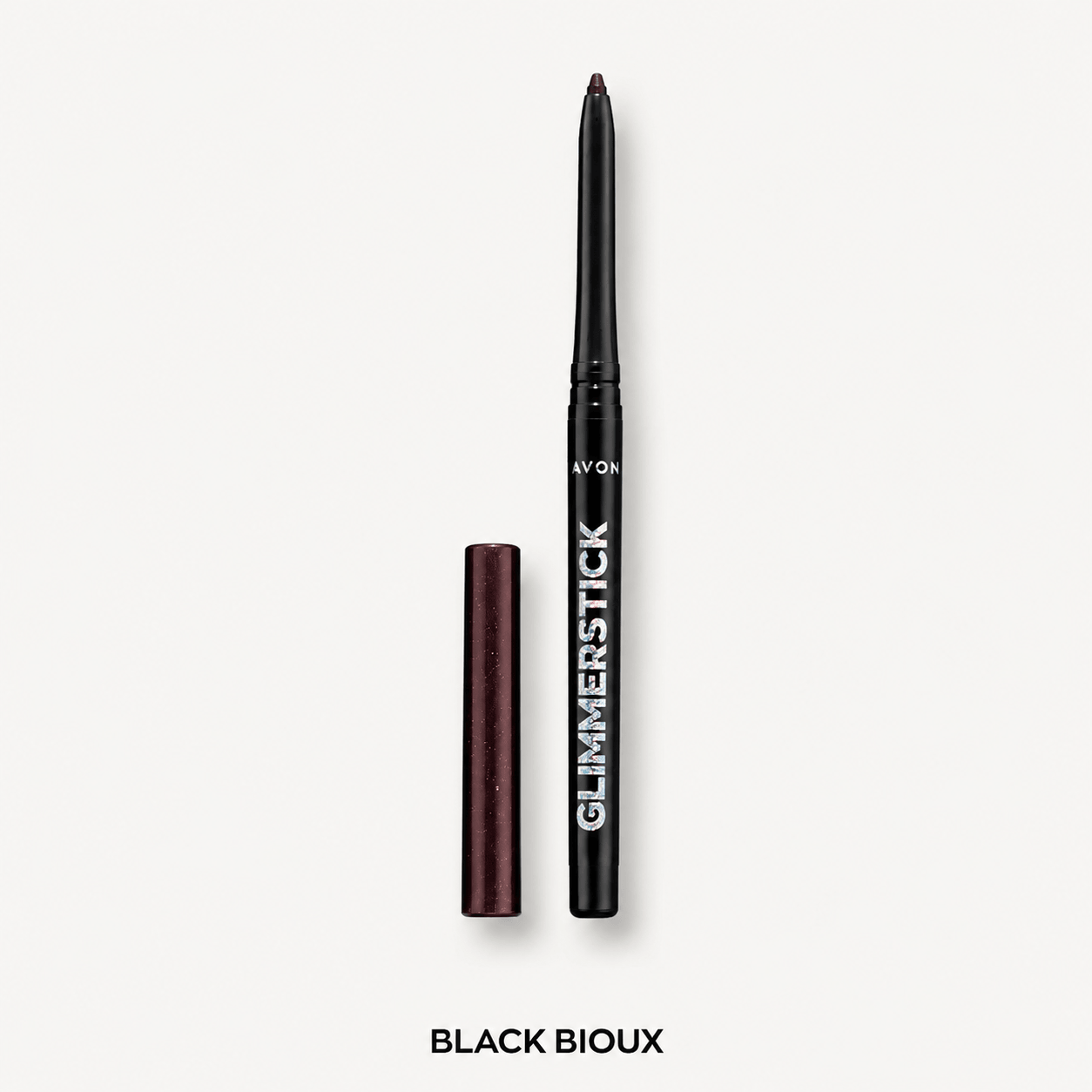 Avon Glimmerstick eyeliner pencil in Black Bioux shade, shown with the cap removed and standing beside the pencil on a light gray background.