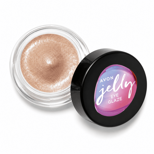 An open jar of Avon Jelly Eye Glaze cream eyeshadow showing the shimmering light gold-brown product, with the black lid placed beside it on a white background.