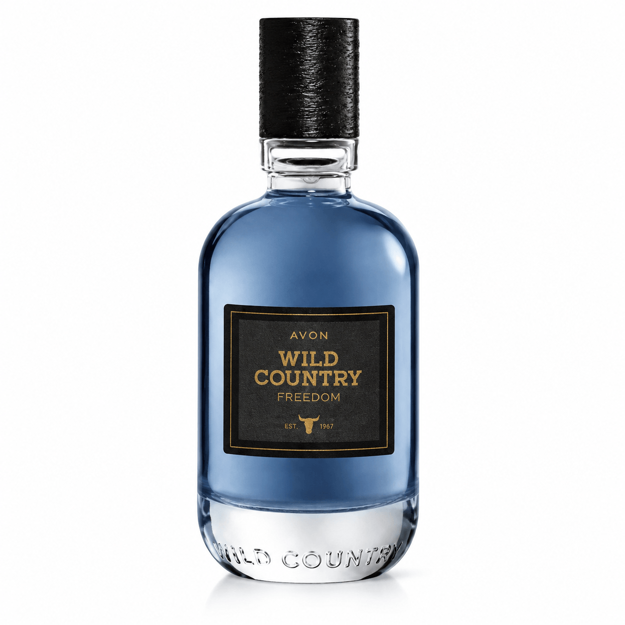 A bottle of Avon Wild Country Freedom fragrance, featuring a blue glass bottle with a black textured cap and a black label with gold lettering, set against a plain white background.