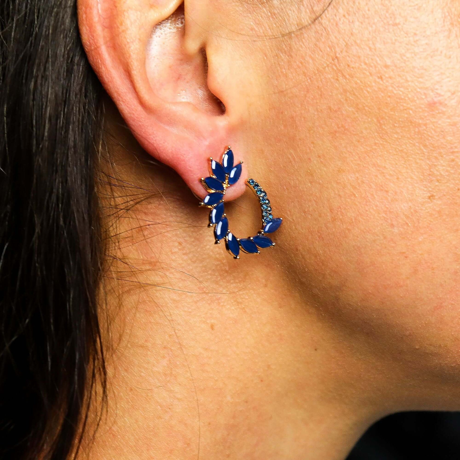 Royal Blue Vintage Glass Loop Earrings By Nymph Aurora worn on a model's ear, showcasing elegant vintage glass design.