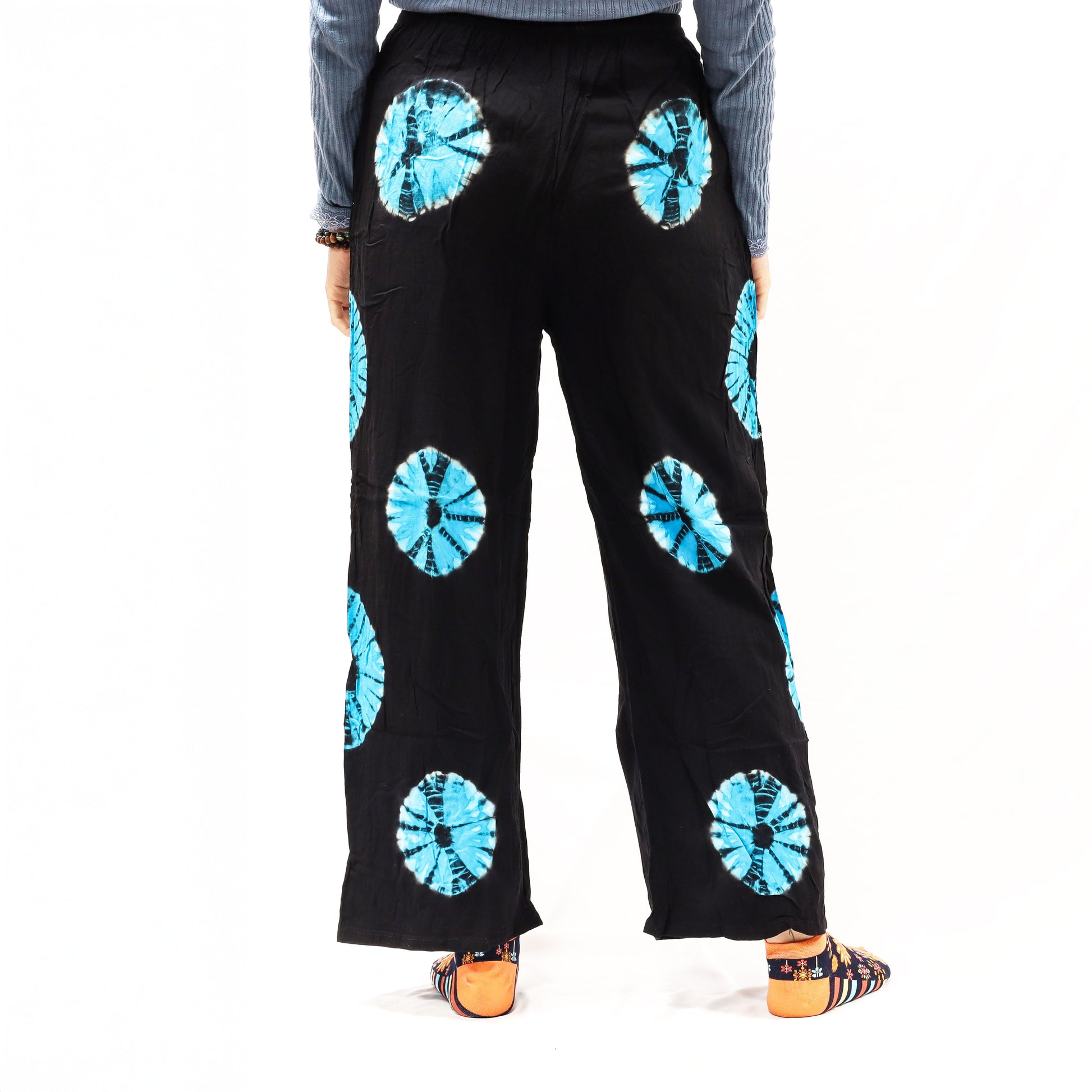 Black Japanese-style tie-dye lounge trousers, large, blue circular patterns on linen-rayon blend.