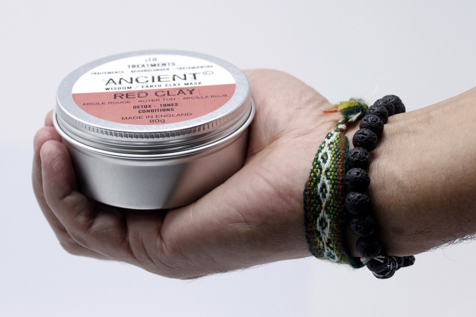 Red Clay Face Mask 80g by Ancient Wisdom - hand holding the metal tin with Red Clay label