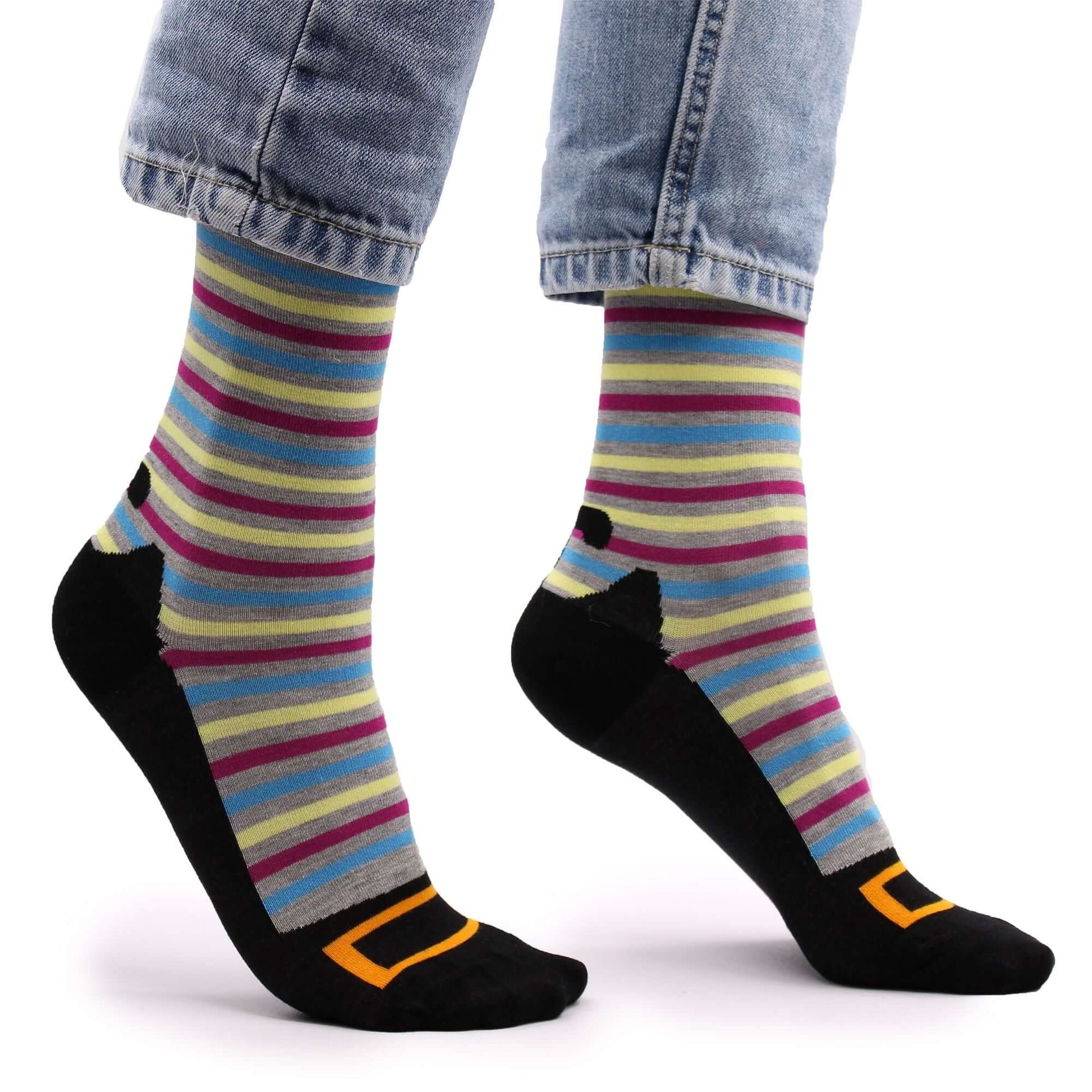 Hop Hare Bamboo Socks S/M - Hocus Pocus featuring colorful stripes and playful design on a model's feet.