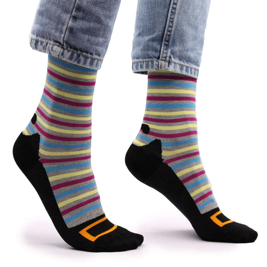 Hop Hare Bamboo Socks S/M - Hocus Pocus featuring colorful stripes and playful design on a model's feet.