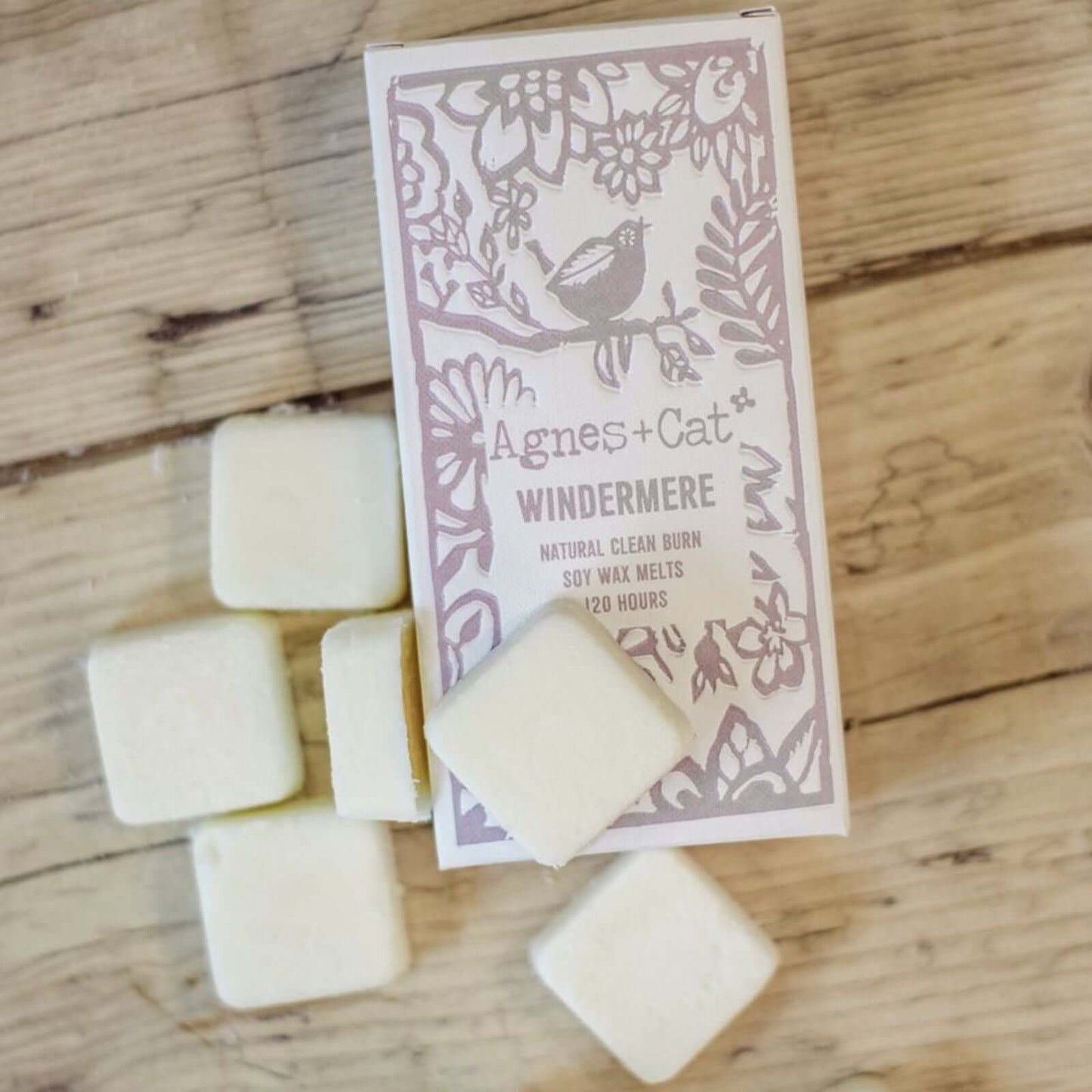 Box of Agnes + Cat Windermere wax melts on a wooden surface