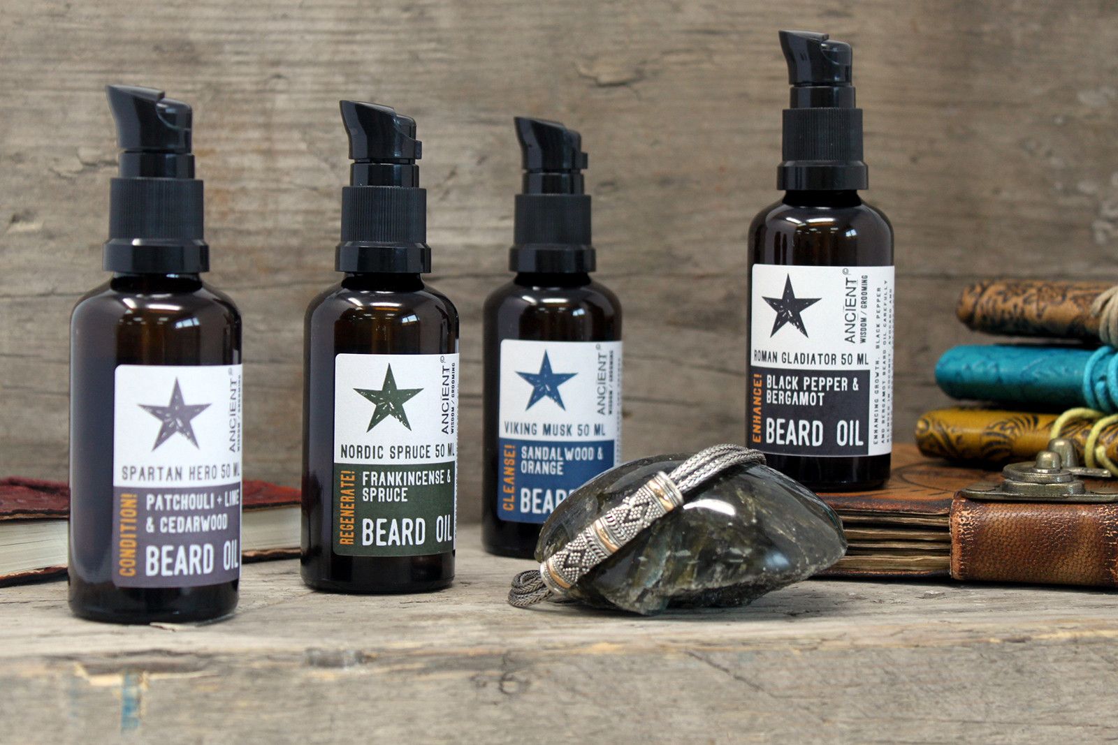 Beard oil bottles with pump tops on a wooden surface, featuring Viking Musk 50 ml beard oil.
