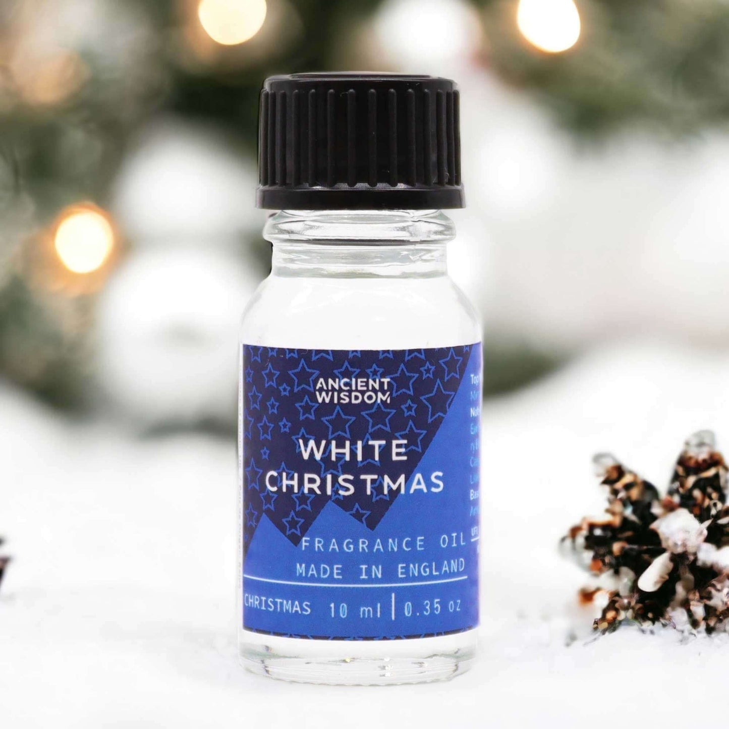 White Christmas Fragrance Oil 10ml in a snowy background, perfect for festive elegance.