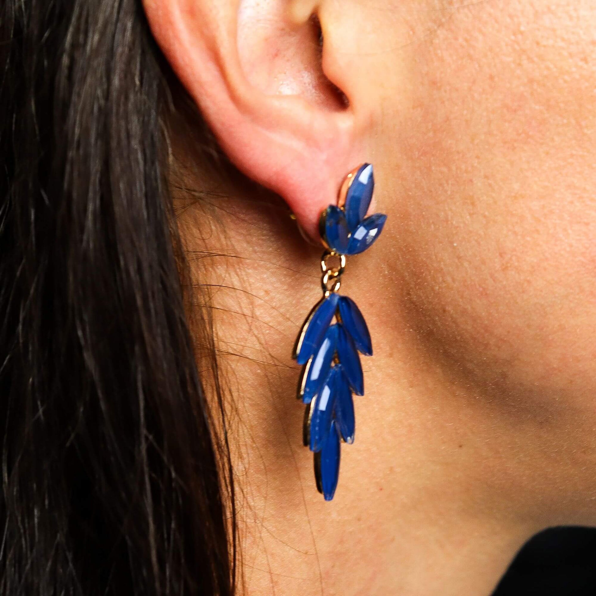 Royal Blue Vintage Glass Long Drop Earrings With Leaf Motif worn by model in close-up, showcasing ocean-inspired design.