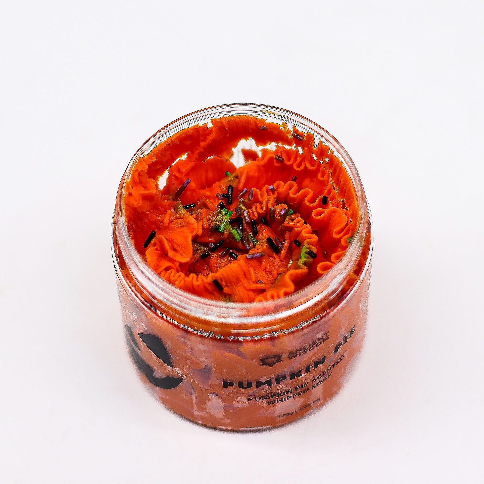 Pumpkin Pie Whipped Soap 120g in a jar, bright orange whipped soap with black and green sprinkles.