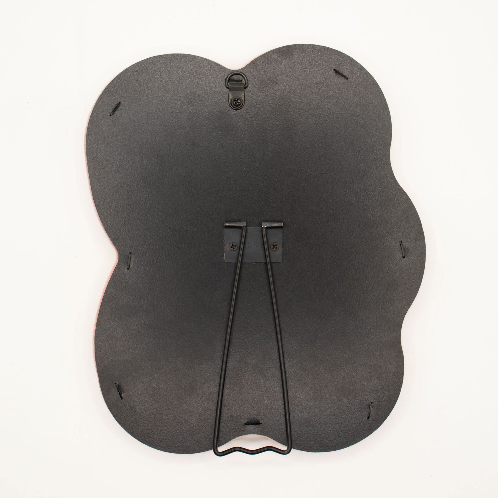 Black butterfly-shaped product on a white background