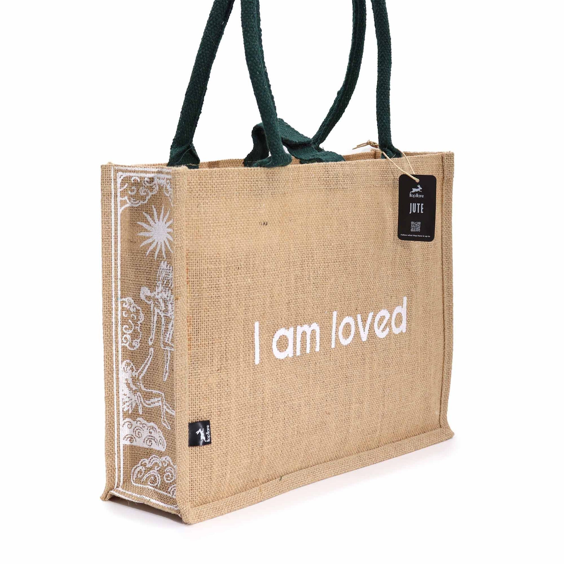 Hop Hare Jute Big Bag - I am Loved jute tote with white Cupid tarot design, green handles and branded Hop Hare tag
