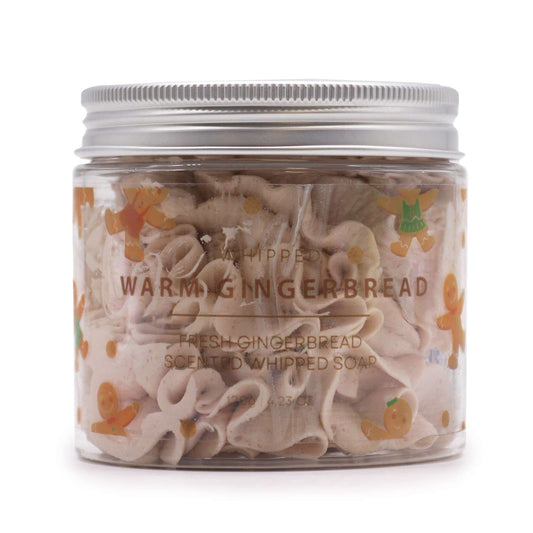 Jar of warm gingerbread whipped soap, 120g, swirled beige soap with orange gingerbread motifs.