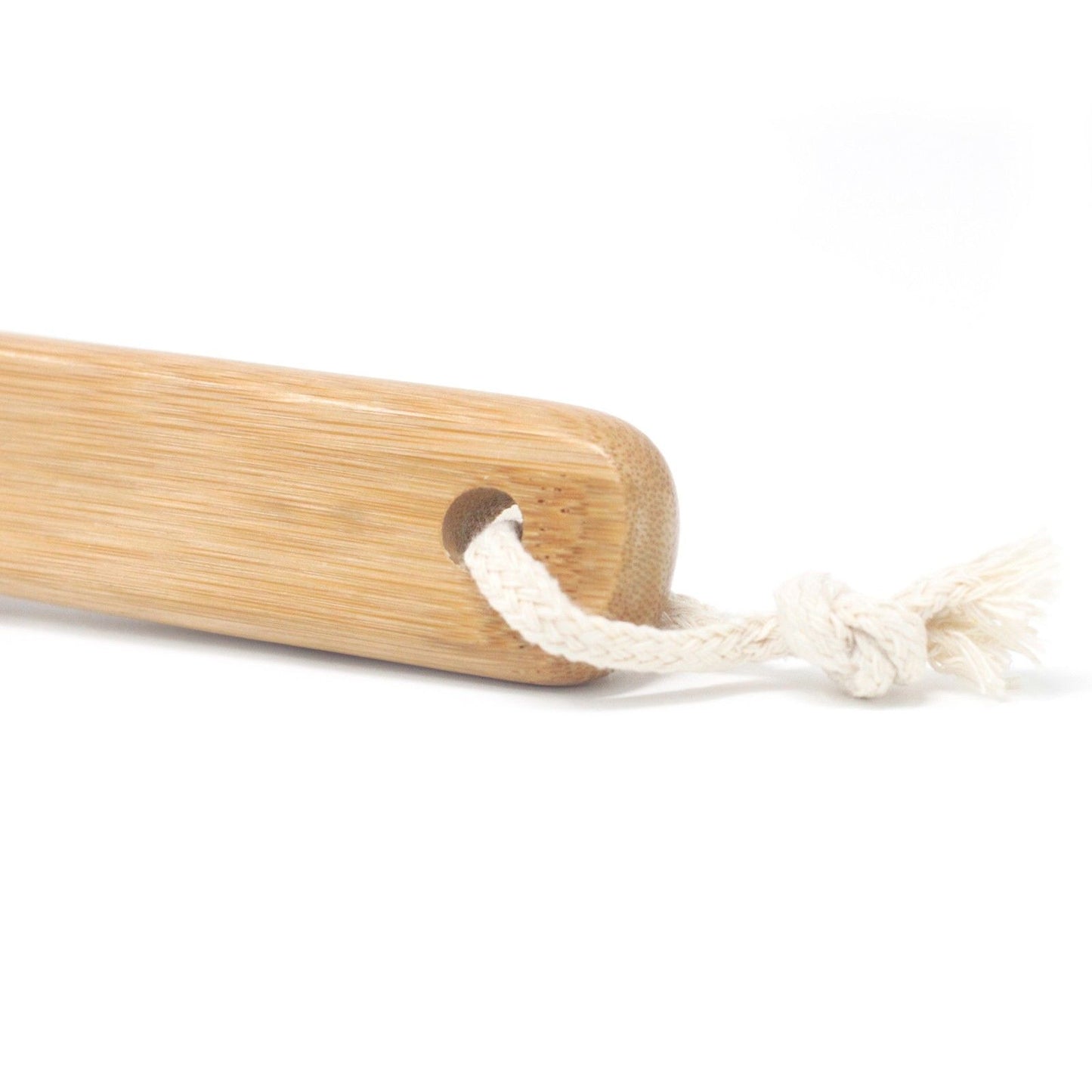 Bamboo beard brush handle with a white hanging cord threaded through a hole.