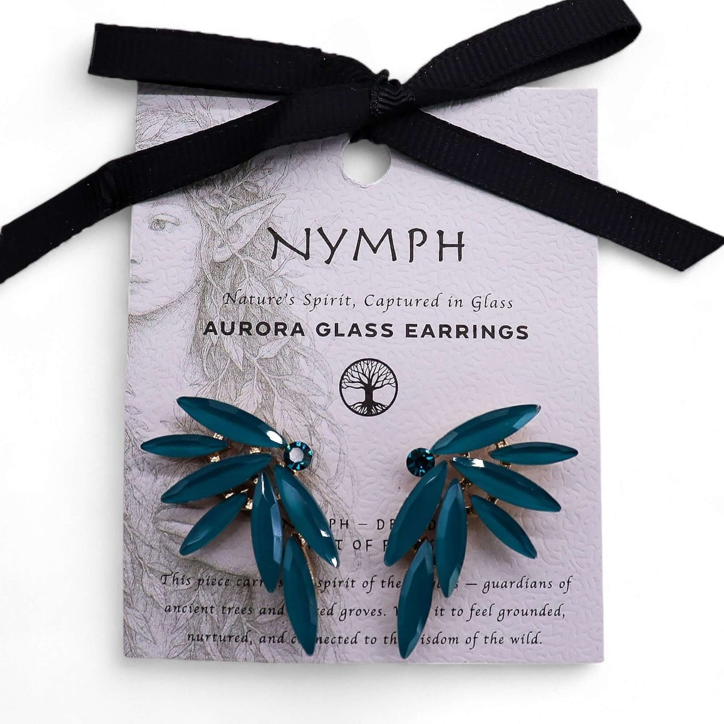 Teal green vintage glass fairy earrings on lavender card with black ribbon.