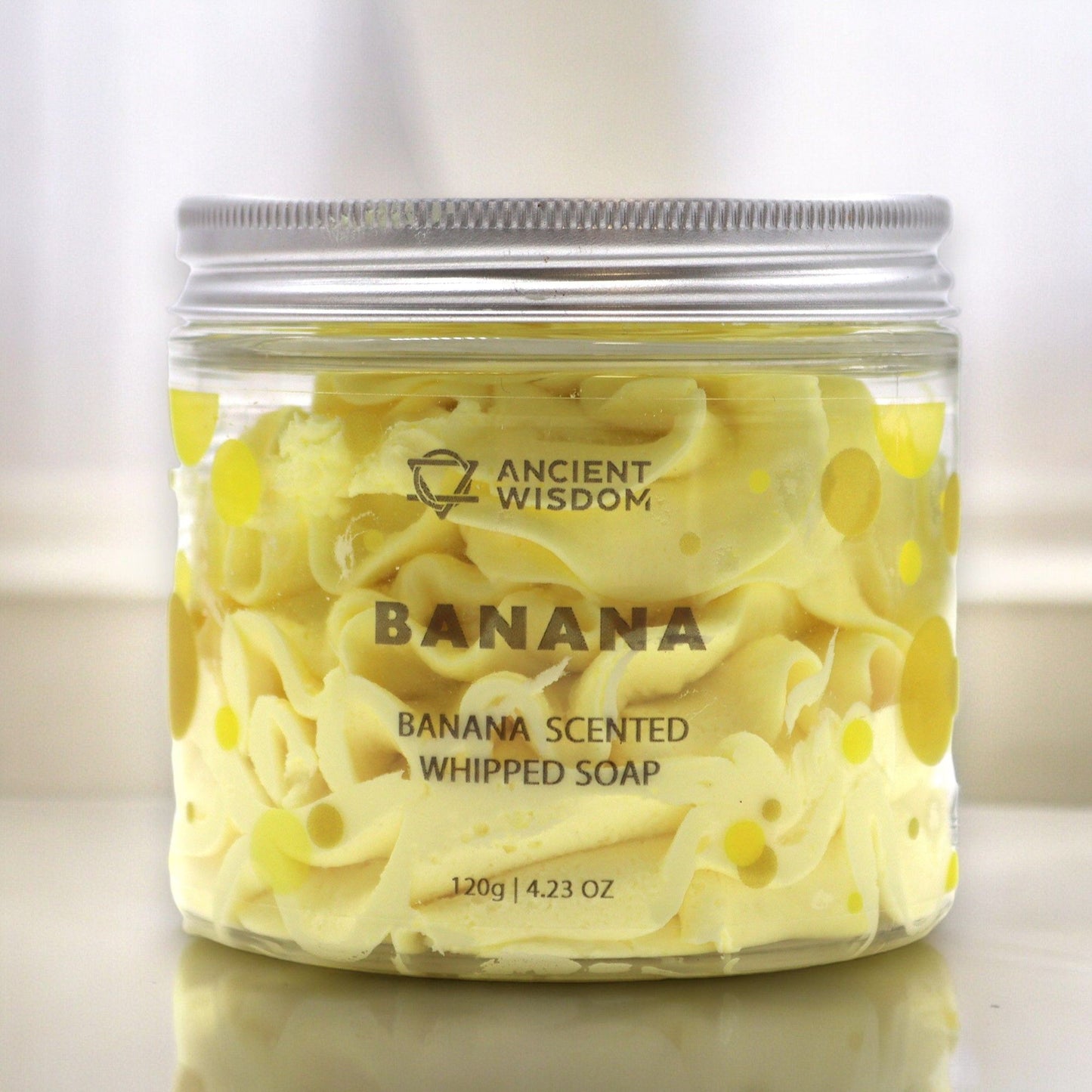 Banana Whipped Soap 120g, banana scented, in a clear jar with yellow polka dots, Ancient Wisdom.