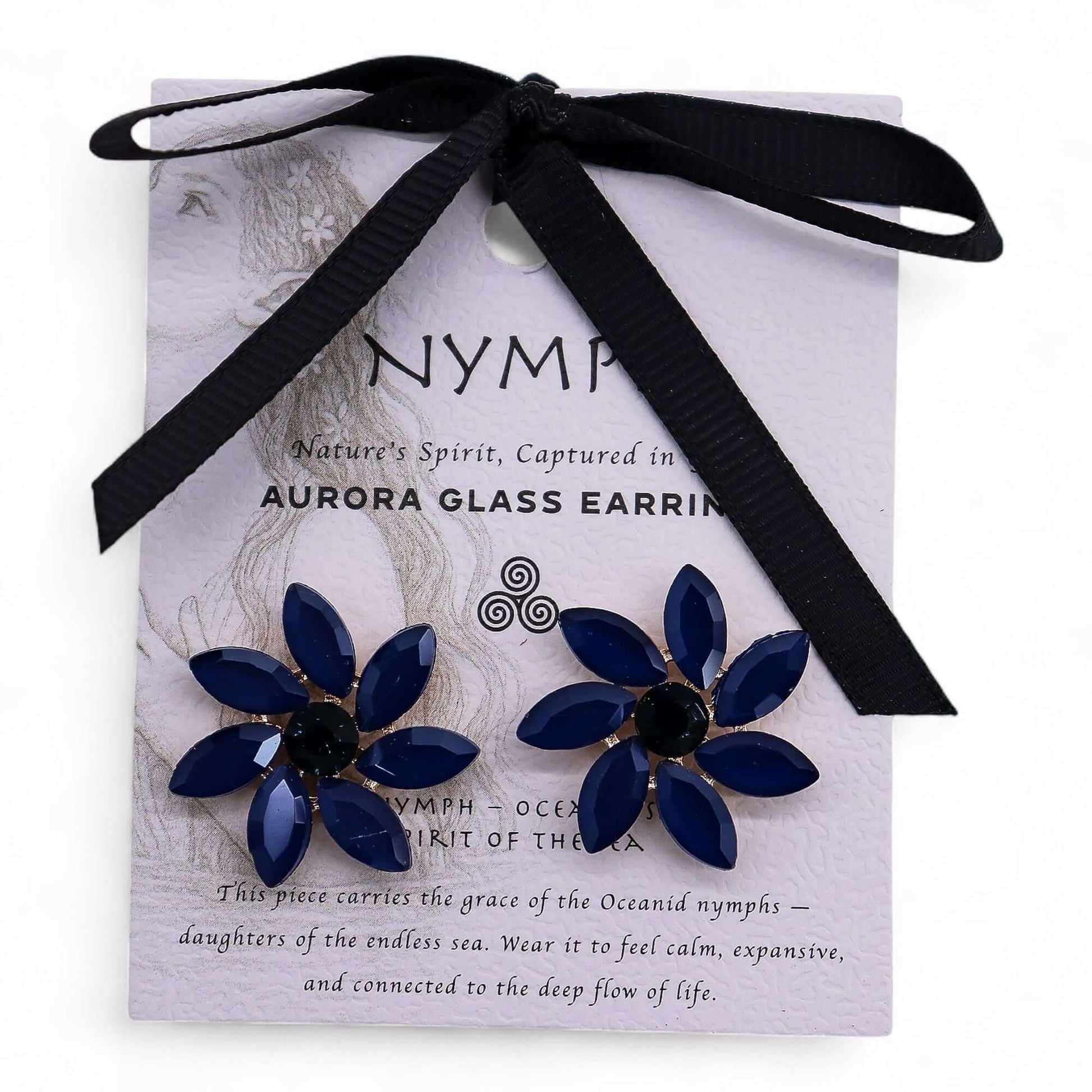 Royal blue vintage glass flower earrings with stainless steel findings on a lilac card.