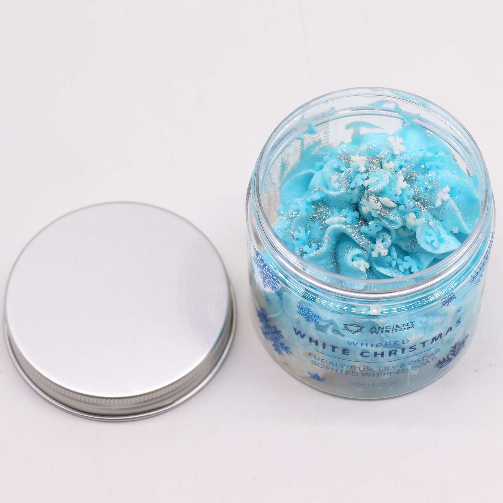 White Christmas Whipped Soap 120g by Ancient Wisdom - blue whipped soap with snowflake sprinkles in a clear jar