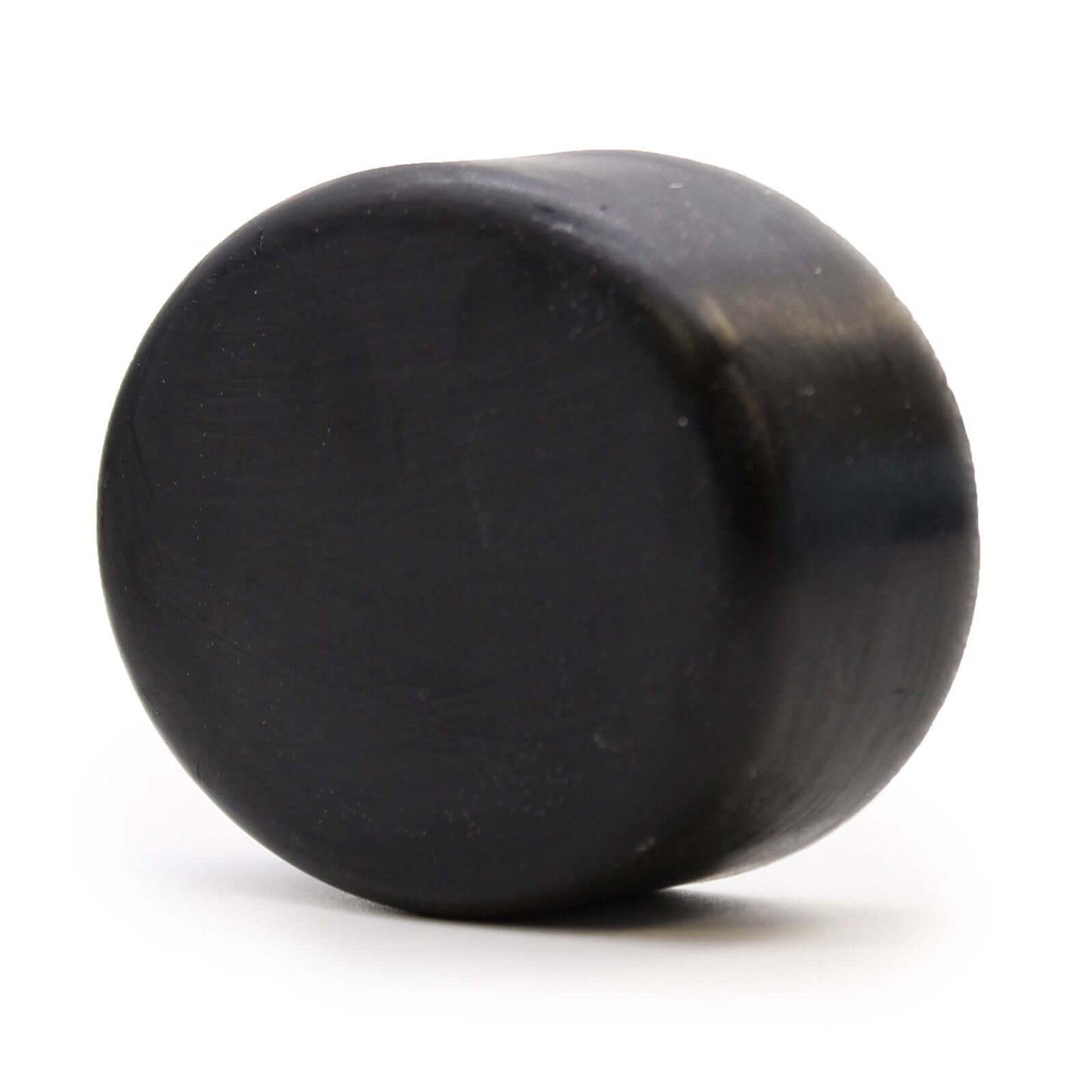 Charcoal Soap 85g - Tea Tree round shape view showcasing the deep black color and smooth texture.