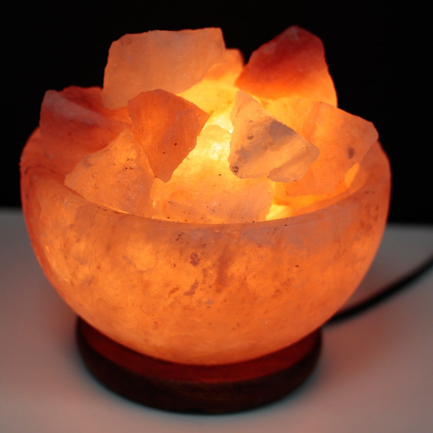 Salt Fire Bowl and Chunks, 15cm x 9cm, glowing Himalayan salt lamp with chunky crystals in a bowl.