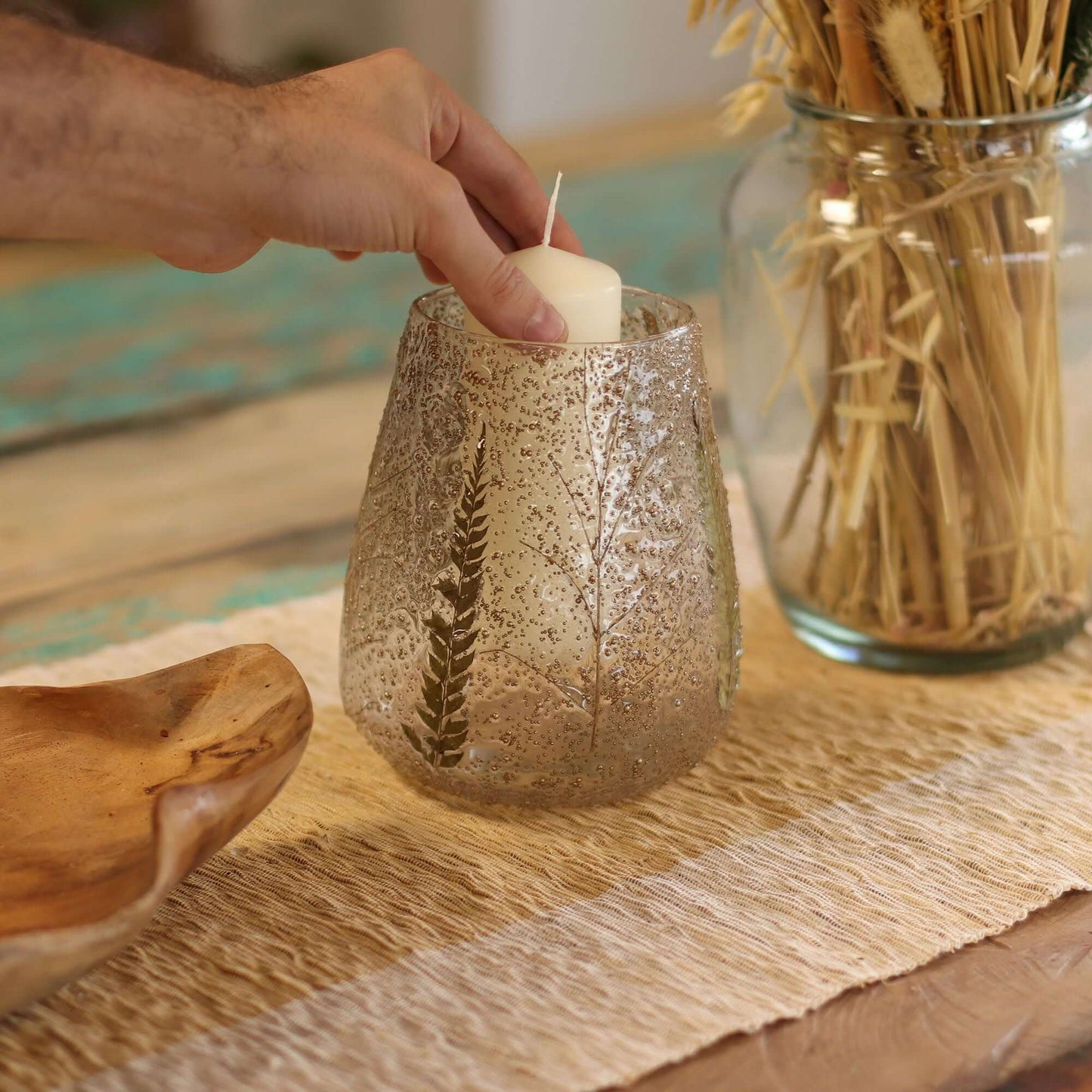 Natural Floral Glass Large Bowl Candle Holder Pino Recycled Fern Leaf Pattern with a candle being placed inside.