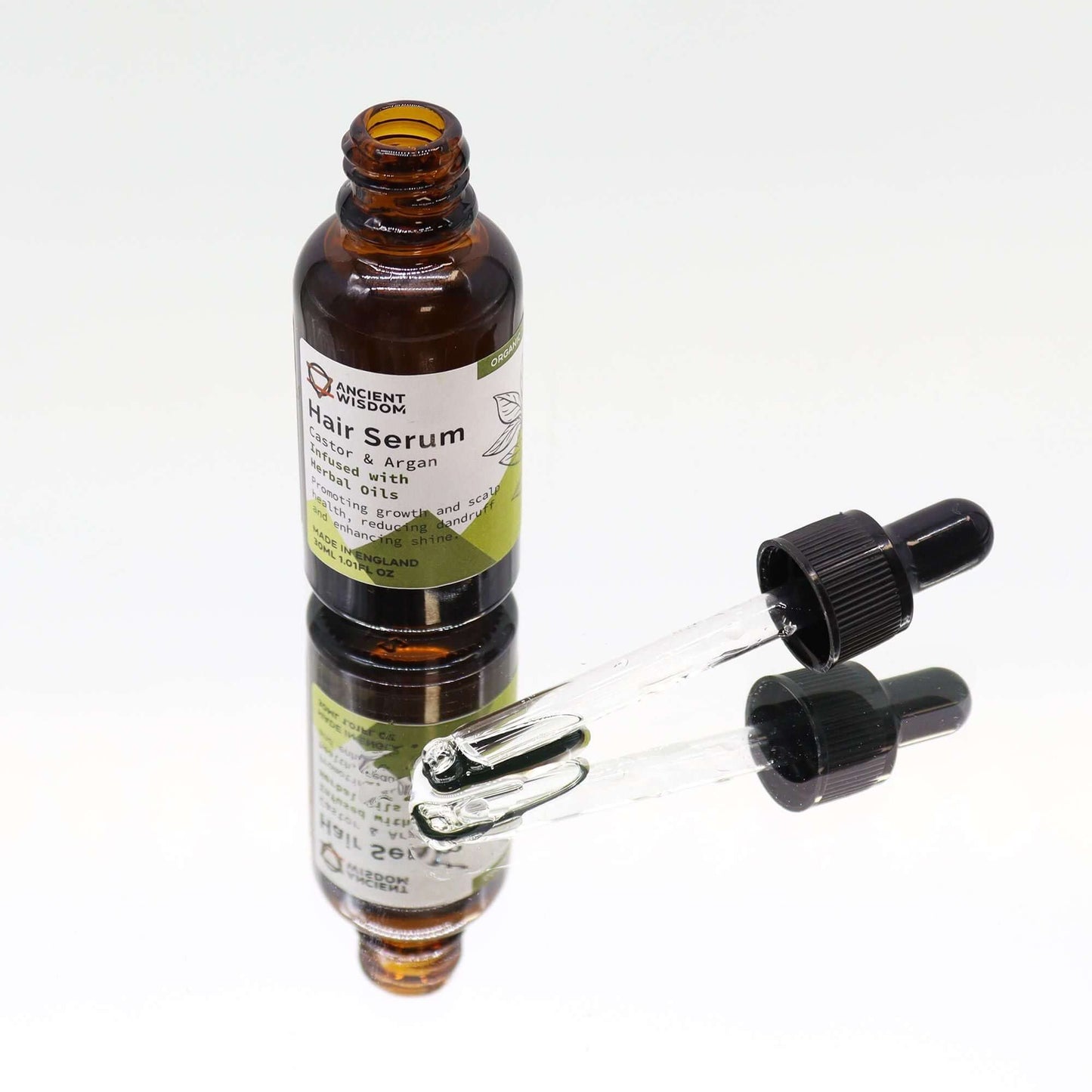Organic Hair Serum 30ml - Herbal bottle with dropper, showcasing key natural ingredients.