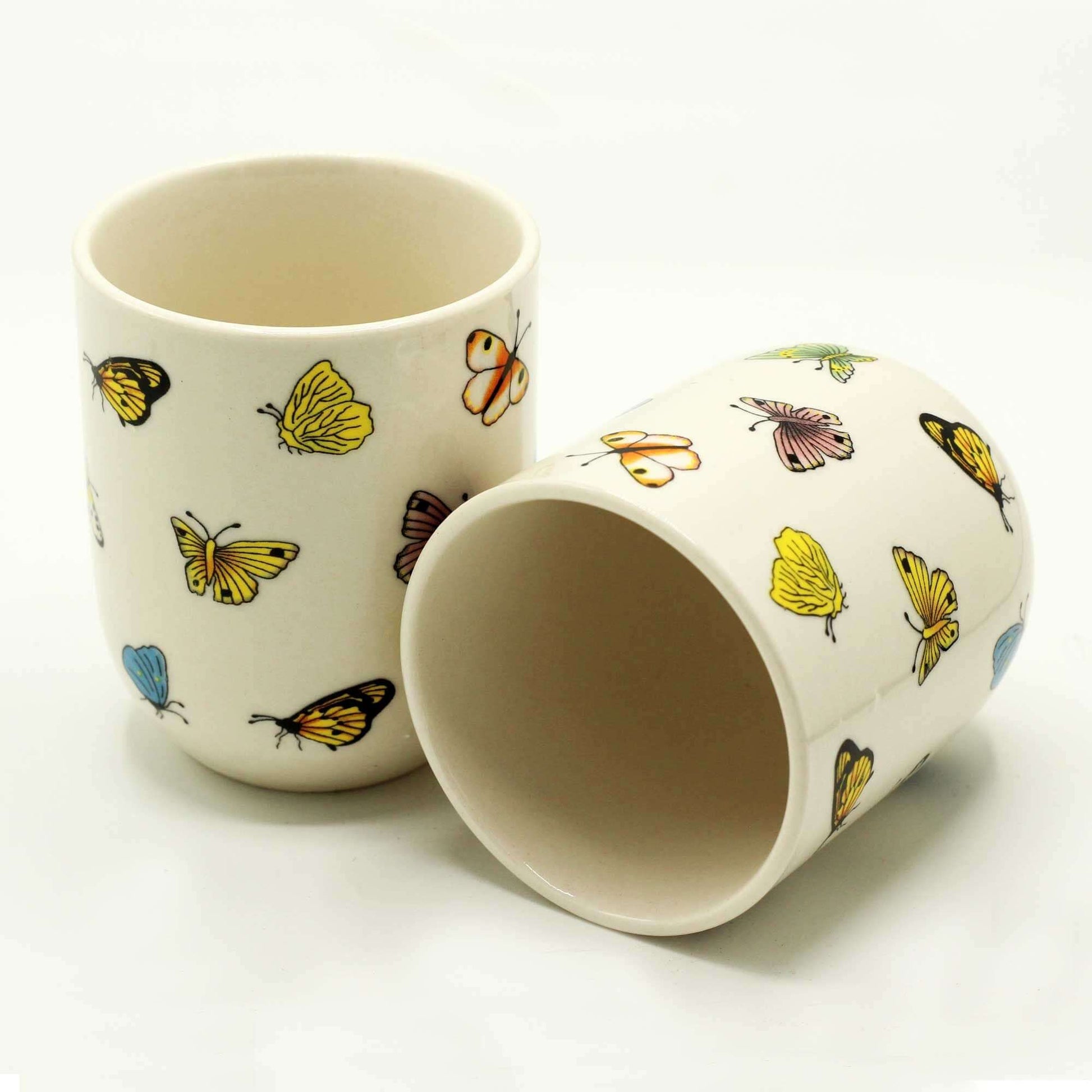 Herbal Tea Cups - Butterflies showcasing colorful butterfly patterns on ceramic, perfect for nature lovers.