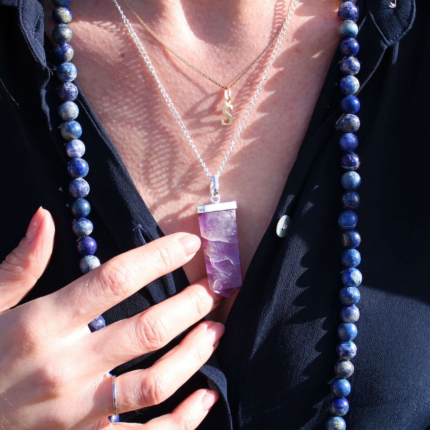 Rock Quartz Flat Pencil Pendant Necklace in Silver Plated showcased on a model with complementary accessories.