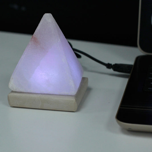 Quality USB Pyramid WHITE Salt Lamp - 9 cm (multi) on a desk with soft purple light.