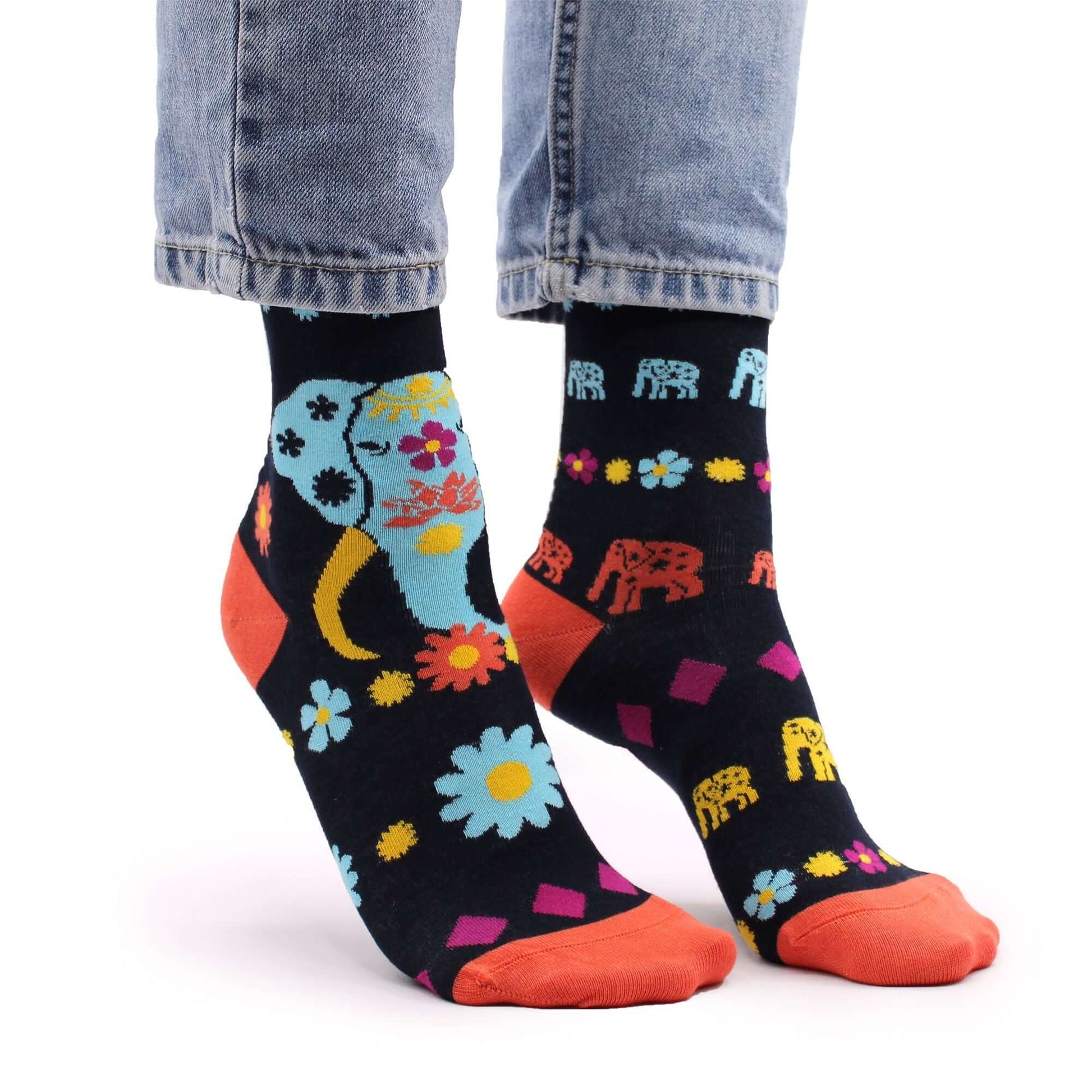 Hop Hare Bamboo Socks S/M - Cosmic Elephant featuring vibrant patterns and colors on a black background.