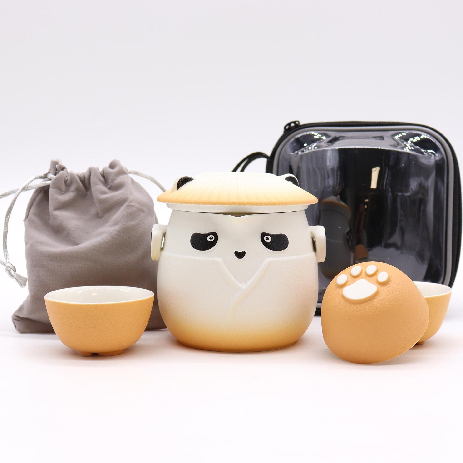 Panda Teapot Set with three orange cups and a panda-themed teapot.