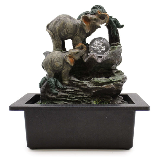 Decorative fountain with elephant sculptures on a white background