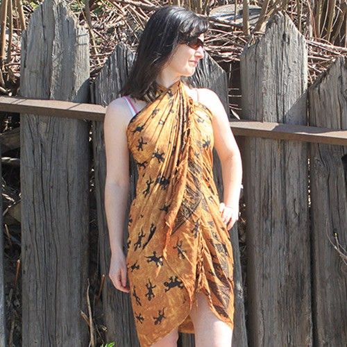Charming Bali Gecko Sarongs - Chocolate featuring a playful gecko pattern on a rich brown base with elegant trim.