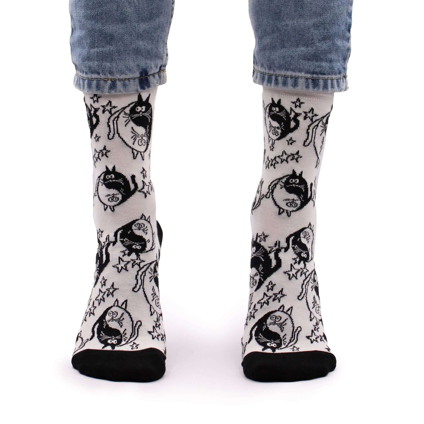 Hop Hare Bamboo Socks S/M - Ying Yang worn by a model, showcasing a fun black and white design.